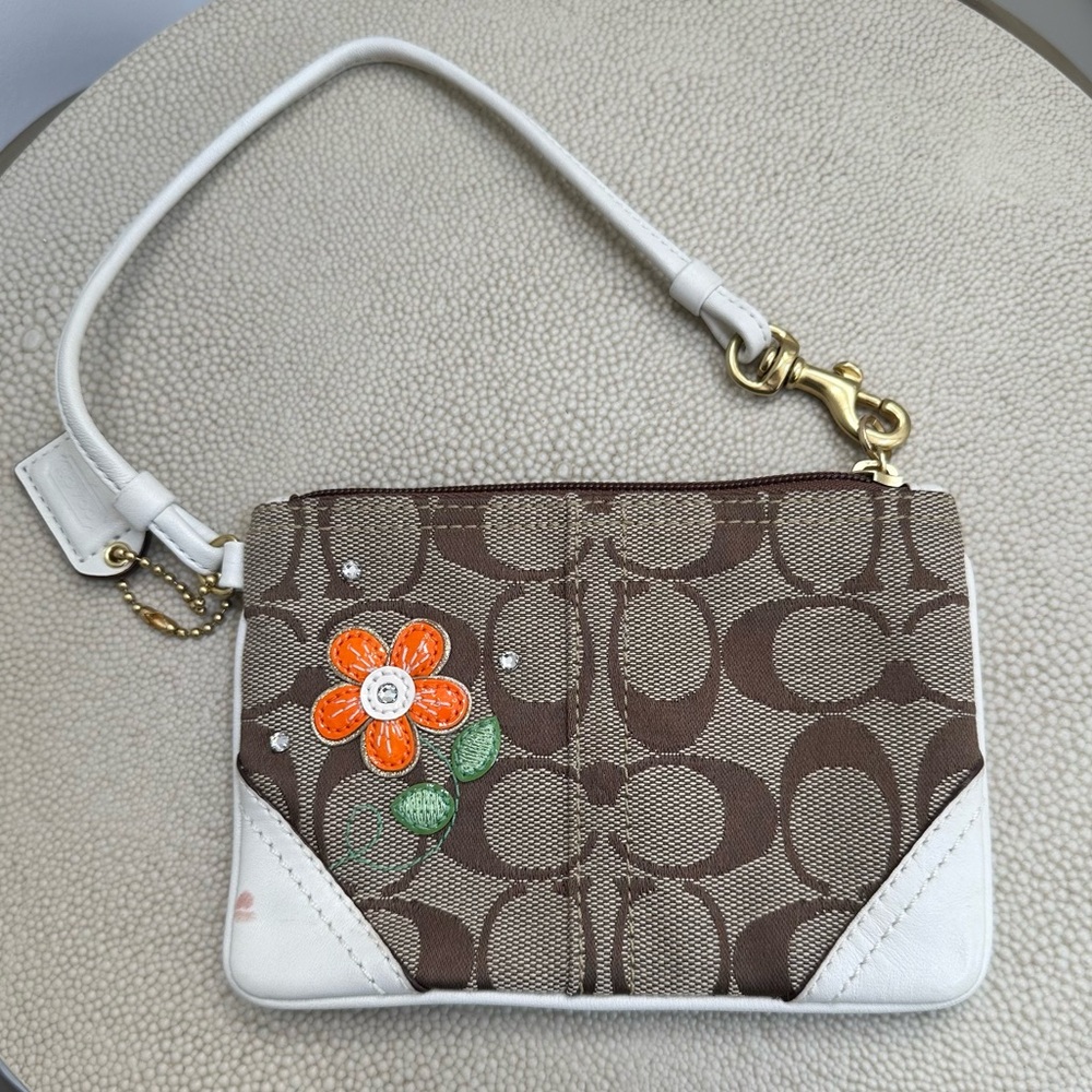 Coach wristlet in signature canvas with floral and crystal accents